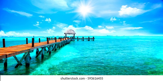 Exotic Paradise. Travel, Tourism and Vacations Concept. Tropical Resort. Caribbean sea Jetty near Cancun, Mexico - Shutterstock ID 593616455