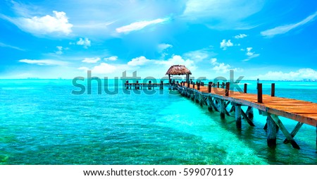 Exotic Paradise. Travel, Tourism and Vacations Concept. Tropical Resort. Caribbean sea Jetty near Cancun, Mexico.