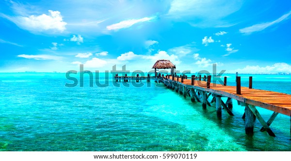 Exotic Paradise.\
Travel, Tourism and Vacations Concept. Tropical Resort. Caribbean\
sea Jetty near Cancun,\
Mexico.