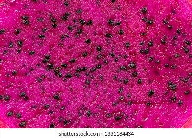 Exotic Pink Dragonfruit Cut Macro Photo On Background. Dragon Fruit Close Up. Pitahaya Texture Photo. Sweet Tropical Fruit, Juicy Pitaya Cut