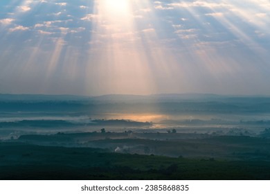 Exotic scenery of nature and wonderful light ray beam over the sky at Phu Sing Hin Sam Wan or Three-Whale Rock in Bueng Kan Province, Thailand - Powered by Shutterstock