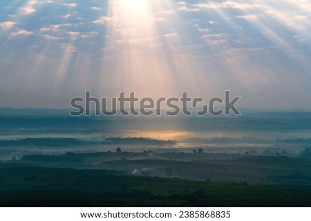 Exotic scenery of nature and wonderful light ray beam over the sky at Phu Sing Hin Sam Wan or Three-Whale Rock in Bueng Kan Province, Thailand