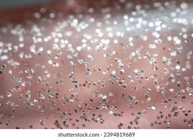 Expanded image of a light pink clear plastic hair clipper. There are glitter beads inside. - Powered by Shutterstock