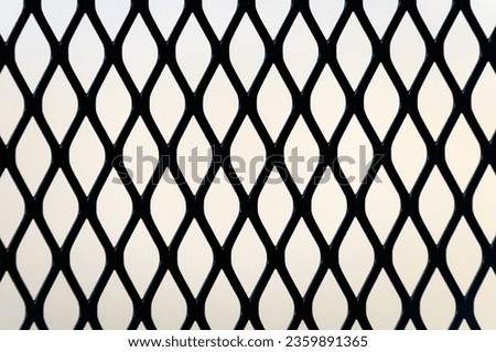 Expanded metal mesh panel pattern as background and design element