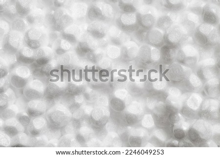 Expanded polystyrene foam porous material white cells circle, close-up macro representing foamed, full depth of field