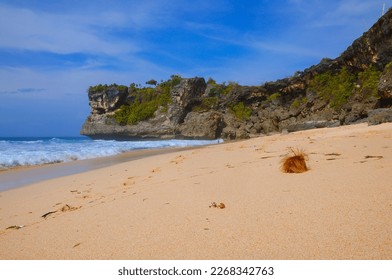 The Expanse of Beach Sand, Sea Waves and Cliffs Under The Blue Sky. - Shutterstock ID 2268342763