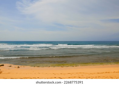 The Expanse of Beach Sand, Sea Waves And Blue Sky. - Shutterstock ID 2268775391
