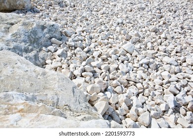 Expanse Of White Different Sizes Gravel In A Construction Site Used In The Construction Industry And Building Activity For The Construction Of Roadbeds