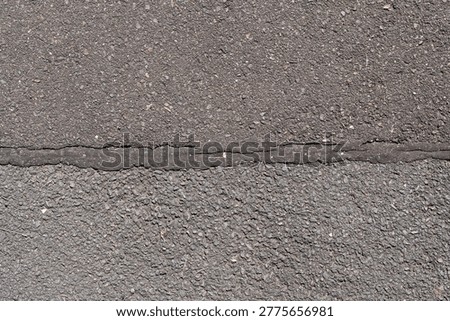 expansion joint between two different asphalt surfaces