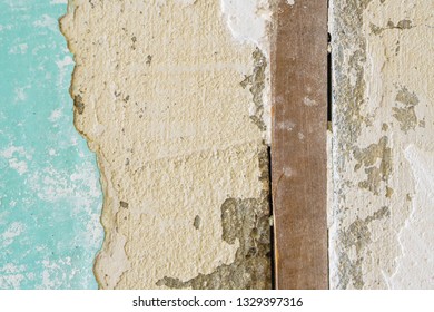 Expansion Joint - Wooden Board Between Reinforced Concrete Blocks in the Wall. Outdated Junction Technology, Reinforced Concrete Structures. Cracked Concrete Texture