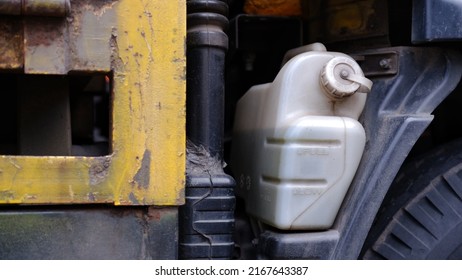 Expansion Tank With Antifreeze Liquid. Vehicle Coolant Level In The Truck Radiator System. Auto Parts