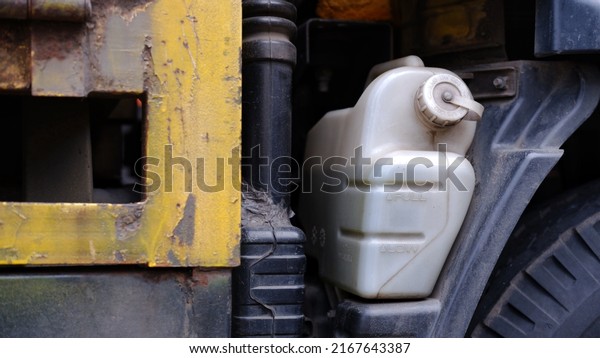 expansion tank with\
antifreeze liquid. Vehicle coolant level in the truck radiator\
system. auto parts