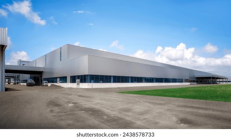 Expansive Industrial Warehouse on Cloudy Day - Powered by Shutterstock