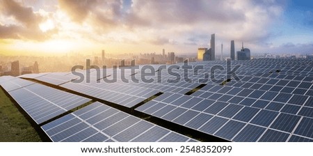 Expansive Solar Panel Array Overlooking a Modern City at Sunset  