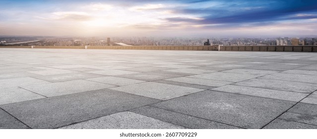 Expansive Urban View with Dramatic Sunset Over City Skyline