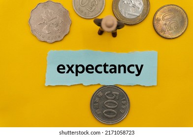 expectancy.The word is written on a slip of paper,on colored background. professional terms of finance, business words, economic phrases. concept of economy. - Shutterstock ID 2171058723