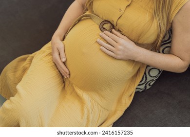 Expectant woman experiences discomfort, feeling unwell during pregnancy - Powered by Shutterstock