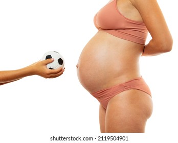 Expecting a brother concept: child hands with soccer ball near mom big pregnant belly