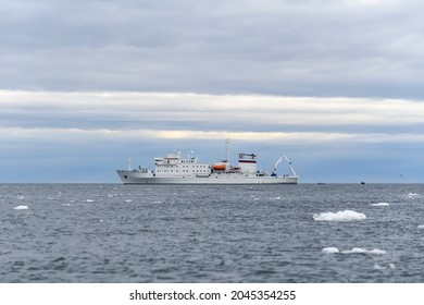 Expedition Ship In Arctic Sea With Ice. White Research Vessel.