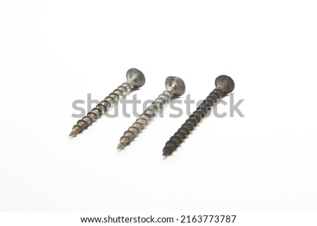 expendable materials. Self-tapping screws and screws on a white background
