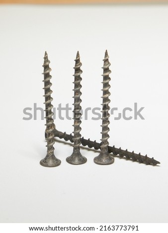 expendable materials. Self-tapping screws and screws on a white background