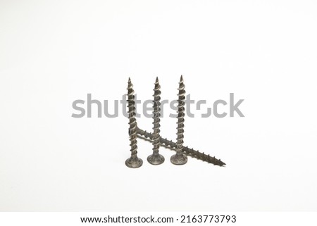 expendable materials. Self-tapping screws and screws on a white background
