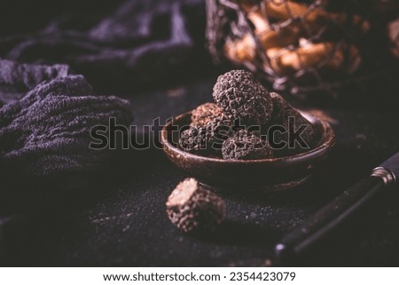 Expensive black truffles gourmet mushrooms  on kitchen table Foto d'archivio © 