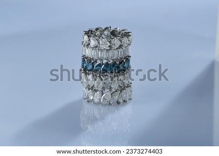 Expensive diamond rings arranged in a group photo