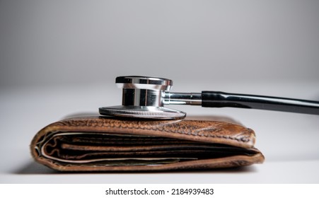expensive medicine concept. stethoscope and wallet as symbol of expensive medicine. - Shutterstock ID 2184939483