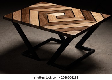 Expensive vintage furniture  The table is covered and epoxy resin   varnished  Luxury quality wood processing  Wooden table dark background  Swirling geometric patterns in the form maze 