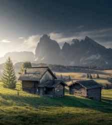 Experience The Beauty Of The Dolomite Mountains With This Serene View Of A Wooden Cabin Tucked Away In The Majestic Peaks. Imagine Waking Up To The Crisp Mountain And Air.