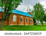 Experience the beauty and tradition of Mary of the Immaculate Conception Church in Alliston, a stunning red brick landmark since 1855