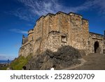 Experience the majestic beauty of Edinburgh Castle, towering against a summer sky, a symbol of Scotland