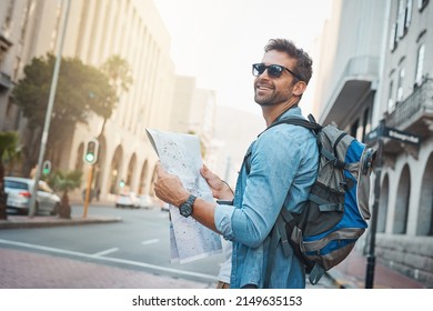 Experience the natural, cultural and man-made wonders of the world. Shot of a young man looking at a map while touring a foreign city. - Shutterstock ID 2149635153