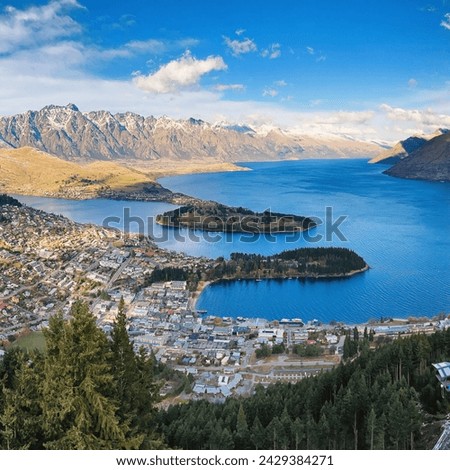 Experience the stunning Queenstown view from Skyline during winter, showcasing snow-capped Remarkables and scenic landscapes in New Zealand.