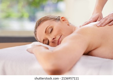 Experience Total Bliss. Cropped Shot Of A Woman In A Day Spa Relaxing On A Massage Table.