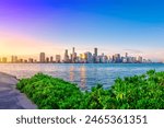 Experience the vibrant and lively atmosphere of Miami Beach with this captivating photograph. Known for its stunning coastline, clear blue waters, and iconic palm trees.