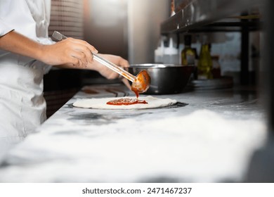 experienced chef - process of making pizza. Professional chef prepares the dough with flour to make pizza or pasta Italian food