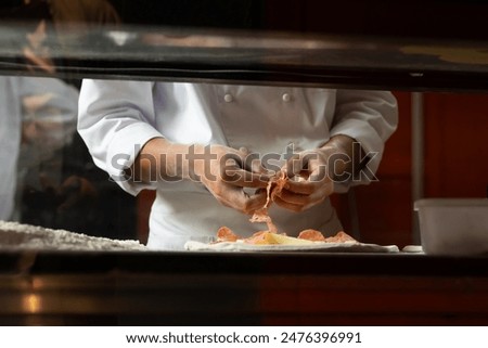 experienced chef - process of making pizza. Professional chef prepares the dough with flour to make pizza or pasta Italian food