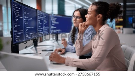 Experienced Coder Mentors Young Programmer To Troubleshoot Complex Software Glitches.
