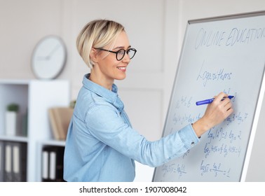 Experienced College Lecturer Teaching Advanced Mathematics Online, Writing Down Complicated Problem On Blackboard. University Math Professor Explaining New Material To Students