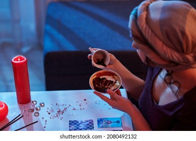 Experienced Dark-haired Fortune-teller Performing The Tasseography Procedure