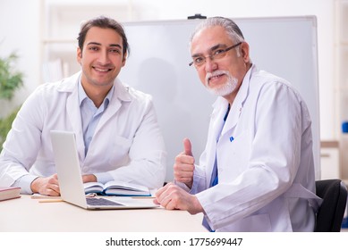 Experienced Doctor Teaching Young Male Assistant