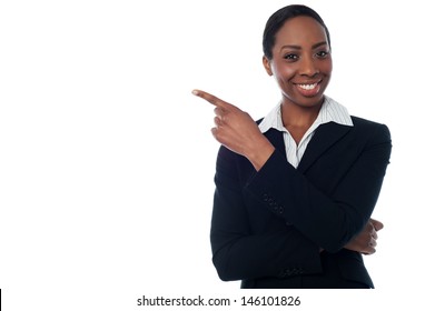 Experienced female executive pointing away