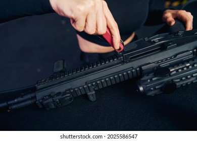 Experienced Female Sniper Assembling Her Assault Rifle