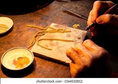 experienced goldsmith making the gold bracelet, Thailand