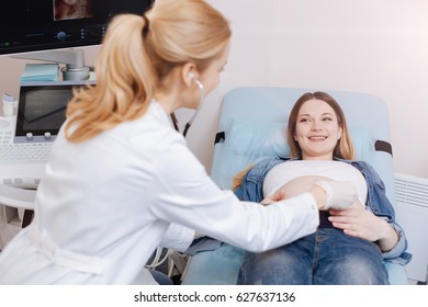 Experienced Obstetrician Listening To The Fetus Heart Beating In The Clinic