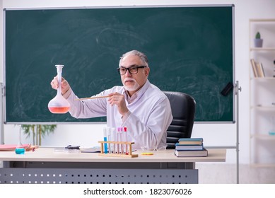 Experienced Old Scientist Working In The Lab