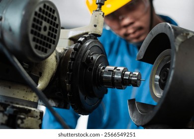 experienced operator technician worker or engineer metalworker industrial in safety helmet working or repair on metal machine, professional maintenance skill man in industry manufacturing. men at work