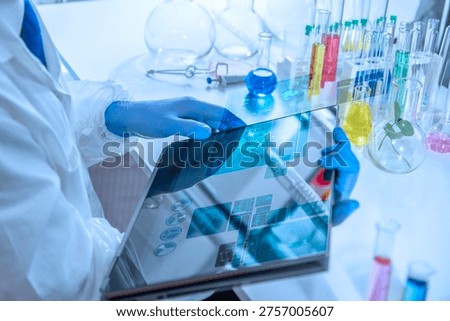 Experienced professor working in a laboratory using artificial intelligence, laptop and holographic scientific interface. Concept of digital research workflow, data visualization, academic standards and future laboratory technology.